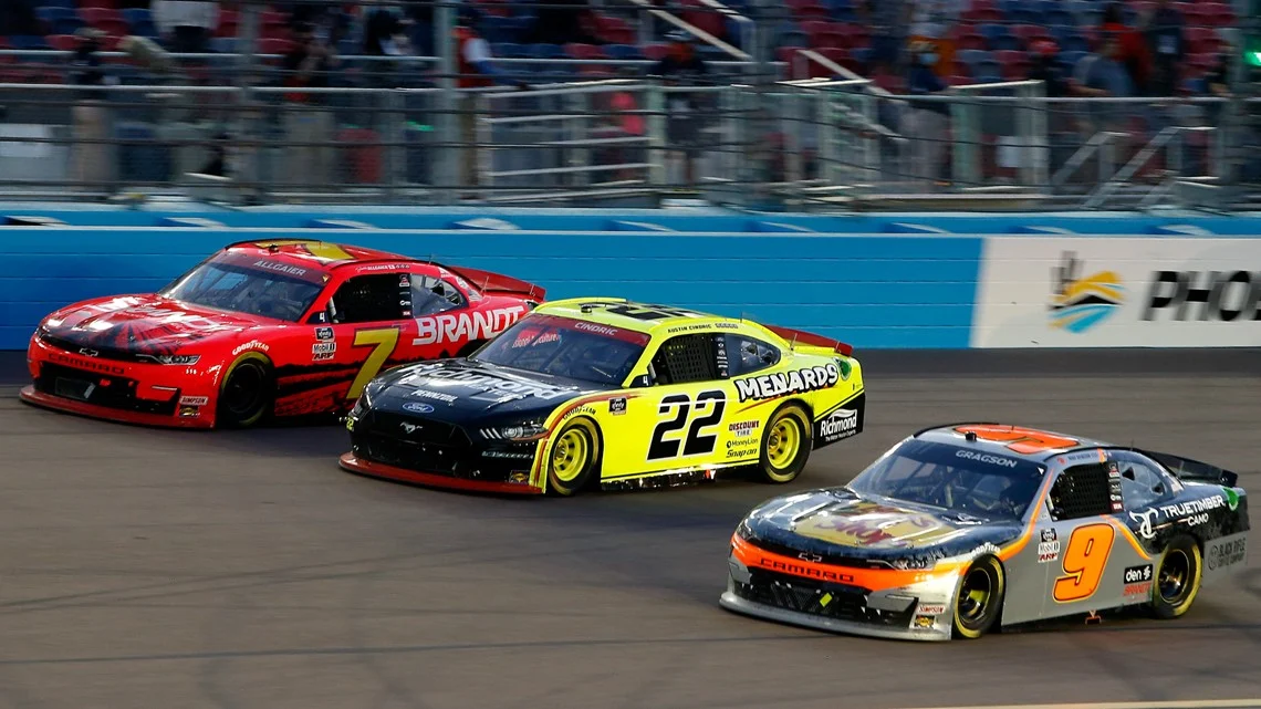 austin cindric drives next to Justin allgaier and noah gragson