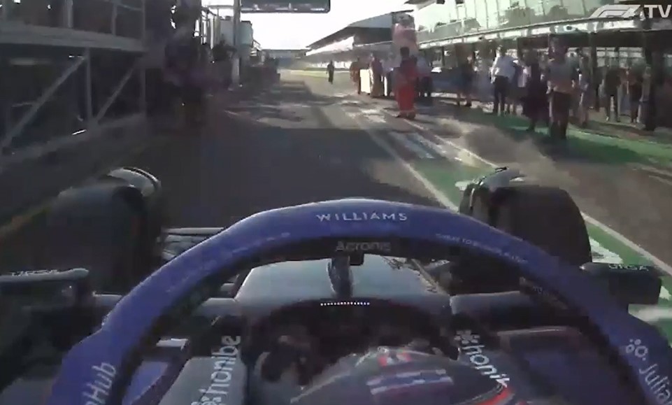 Close call as fans are pictured walking on the pitlane as Alex Albon was making his last lap pitstop