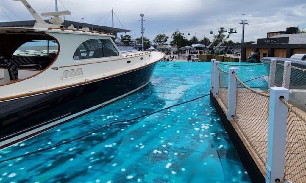 F1 pundit Craig Slatter tries to take a dip in Miami Circuit's fake marina