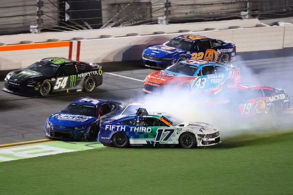 Kyle Larson crashes into Chris Buescher and Ryan Preece during the 2026 NASCAR Cup Series Coke Zero Sugar 400 at Daytona International Speedway